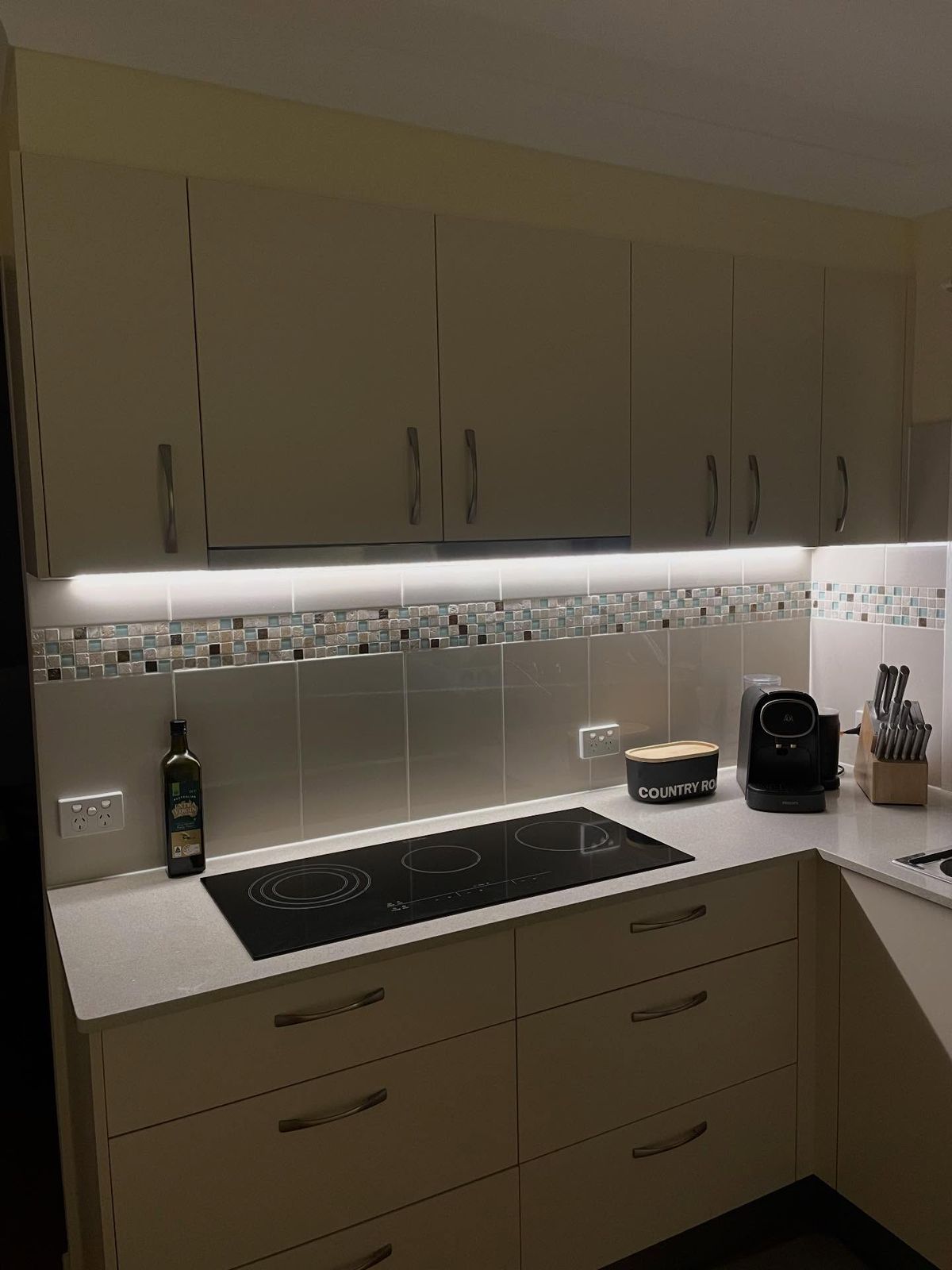 Kitchen with new LED strip lighting under the overhead cabinets